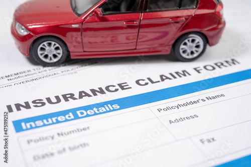 Red car on Insurance  claim accident car form, Car loan, insurance and leasing time concepts.