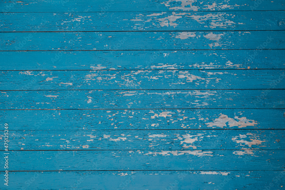 Naklejka premium old wooden blue wall of planks texture as background