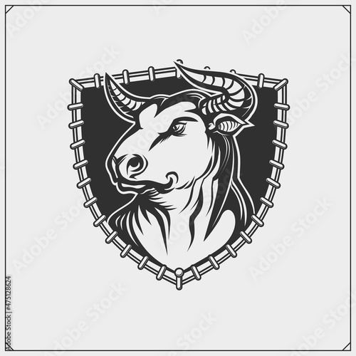 Label with aggressive bull. Corrida emblem. Vector illustration. Print design for t-shirt.