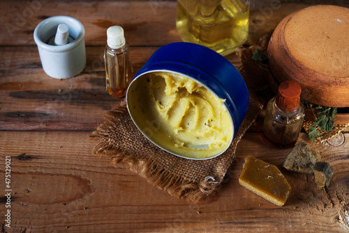 homemade bee wax and oil based salve and traditional natural ingredients for it preparation