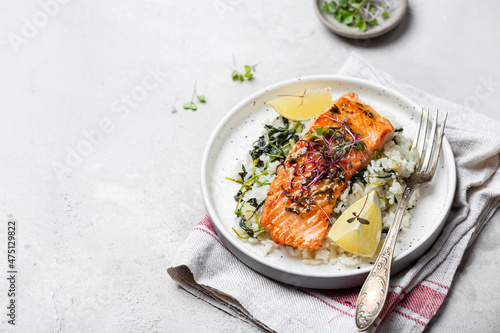 salmon steak with lemon rice and spinach