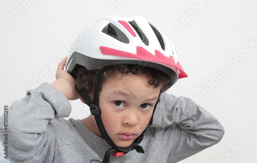 Boy with bike riding helmet with white background stock photo  © herlanzer