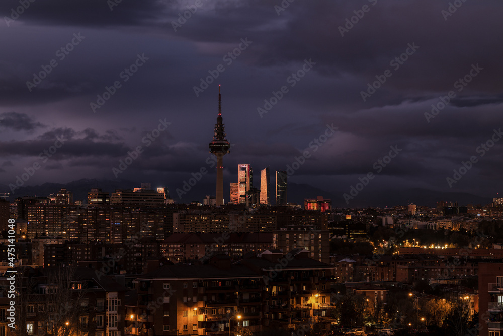 Naklejka premium Panorama of city of Madrid, Spain, at night, with high tower buildings on background
