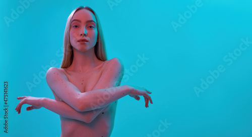 Confident nude caucasian girl looking at camera