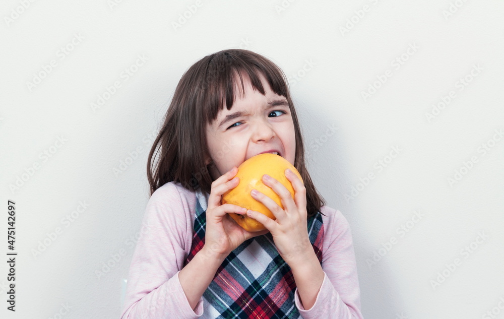 Child girl eating the apple