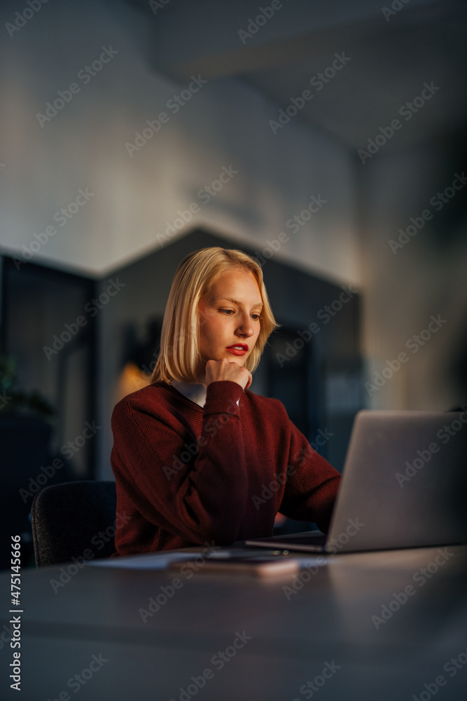 Concentrated caucasian woman, trying to fix mistakes in her code. Concentrated caucasian woman, trying to fix mistakes in her code.