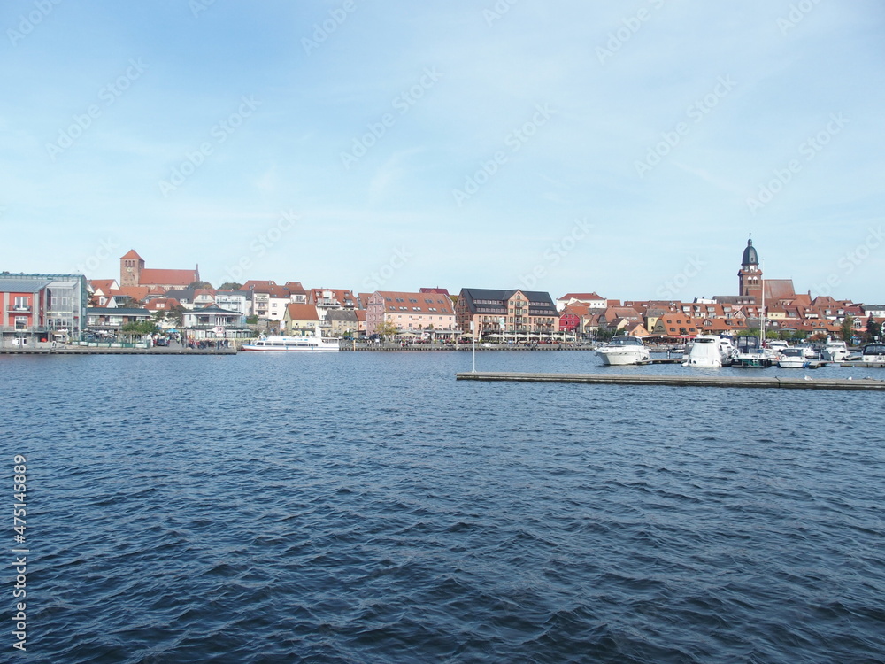 View over the Mueritz harbor to the old town of Waren, Mecklenburg-Western Pomerania, Germany, on the left the St. Georgen Church, on the right the St. Mary's Church