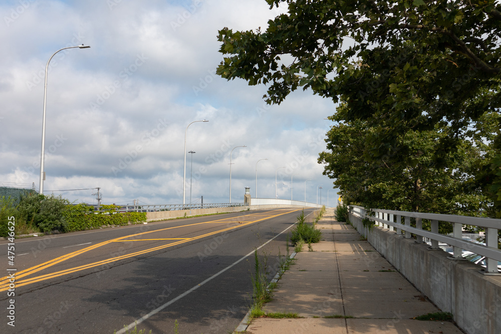 Empty Road and Sidewalk leading to a Bridge in New Haven Connecticut