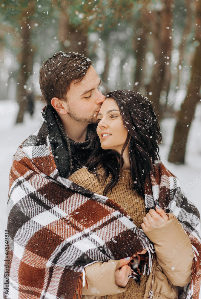 Love story in the winter forest. Valentine's Day concept