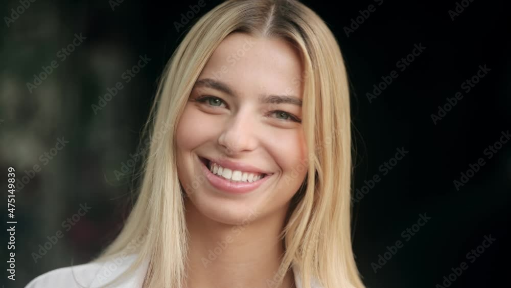 Close up portrait of a smiling blond woman. Beauty Woman face Portrait. Beautiful model Girl with Perfect Fresh Clean Skin Close up portrait of a smiling blond woman. Beauty Woman face Portrait. Beautiful model Girl with Perfect Fresh Clean Skin