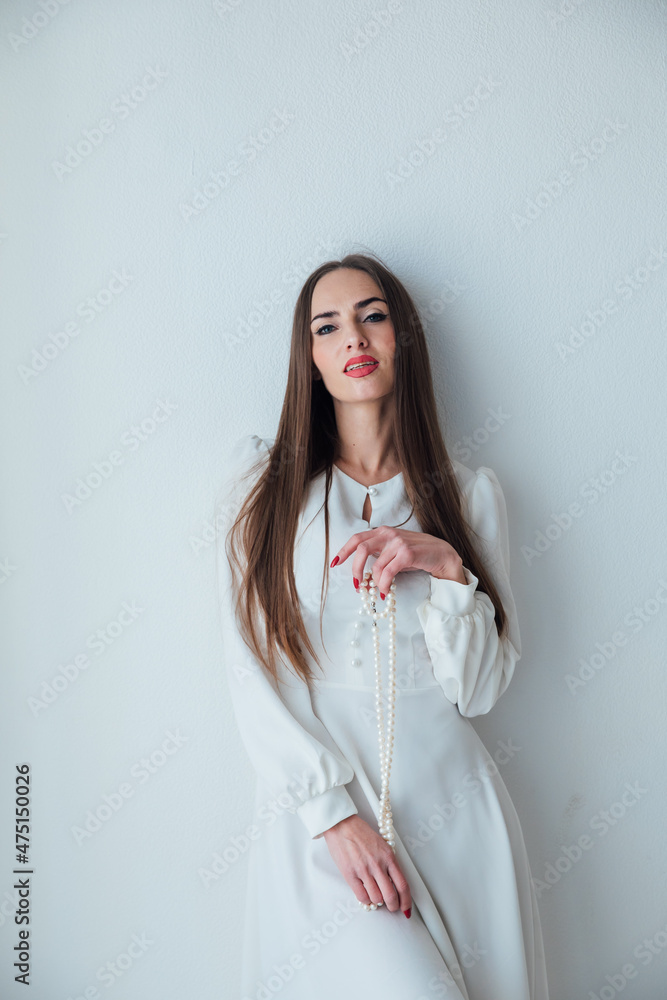 portrait of a beautiful woman in a light summer dress on a white background portrait of a beautiful woman in a light summer dress on a white background