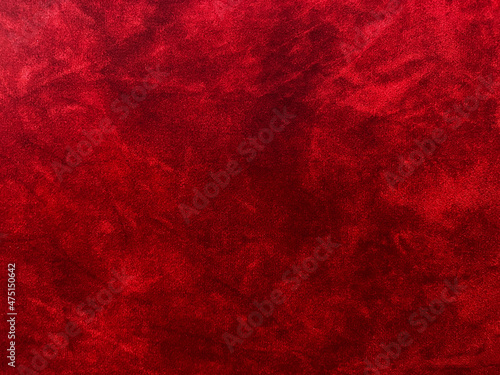 Dark red velvet fabric texture used as background. Empty dark red fabric background of soft and smooth textile material. There is space for text..