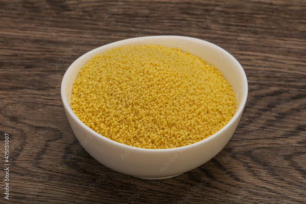 Raw cous cous heap in the bowl Raw cous cous heap in the bowl