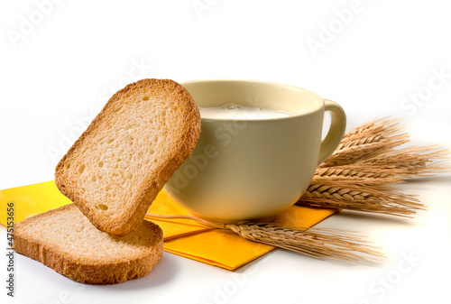 фотографія set for a breakfast with milk and rusks