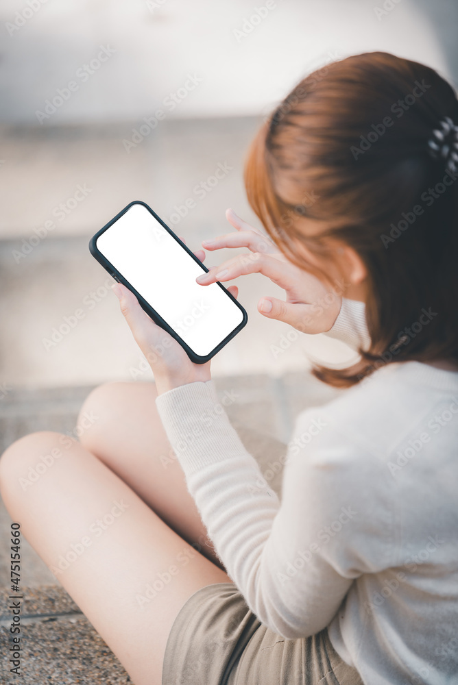 beautiful woman holding a blank screen smartphone beautiful woman holding a blank screen smartphone
