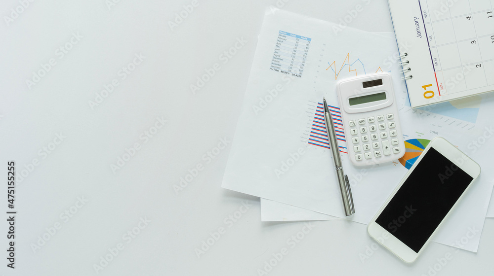 top view of dashboard statistic chart report and calculator, smartphone,pen and calendar on white background to plan or analyzing the company's profit or business strategy 2022 resolution top view of dashboard statistic chart report and calculator, smartphone,pen and calendar on white background to plan or analyzing the company's profit or business strategy 2022 resolution