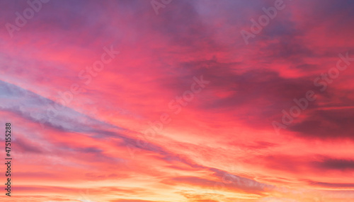 Sunset with a colorful sky in orange, yellow, purple and pink, Horizon twilight in the evening with a beautiful dusk sky sunlight in Winter at countryside,Image Nature for Holiday banner background 