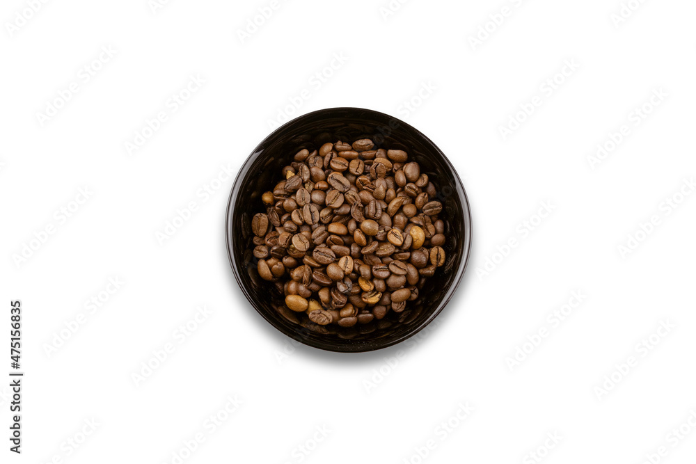 Black bowl with brown coffee beans, view from above, isolated on white background Black bowl with brown coffee beans, view from above, isolated on white background