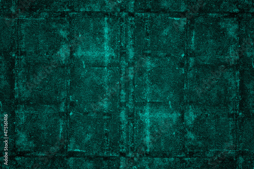 Aged dark cyan concrete wall with abstract pattern and heavy grunge texture for background
