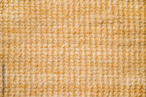 Jute carpet close-up. A fragment of a large weave, background, texture.Handmade products. Eco-friendly material.