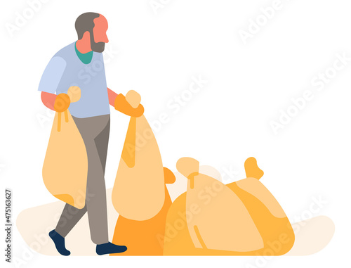 Man throws plastic bags to pile. Garbage stockpile