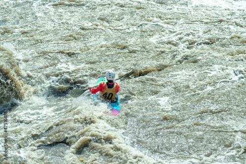 one person kayaking in a fast mountain river
