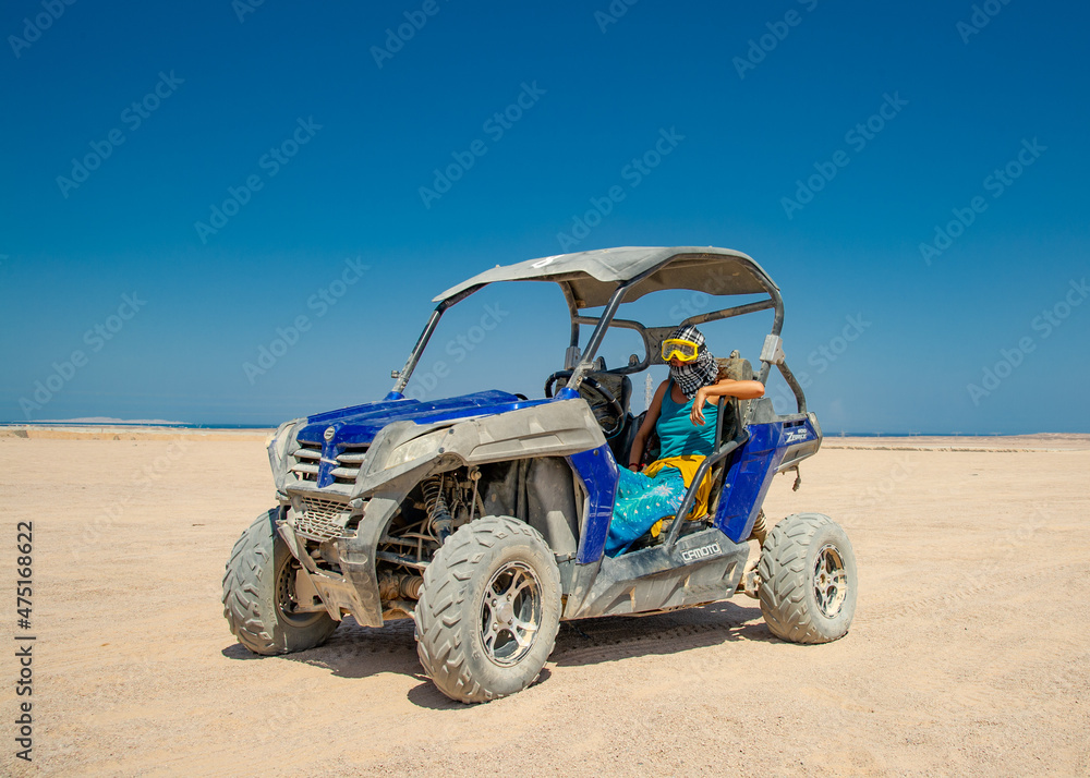 Female driving Atv in desert Egypt Hurgada Female driving Atv in desert Egypt Hurgada