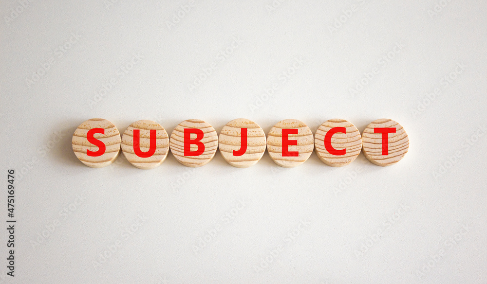 Subject symbol. The concept word Subject on wooden circles. Beautiful white background, copy space. Business and subject concept.