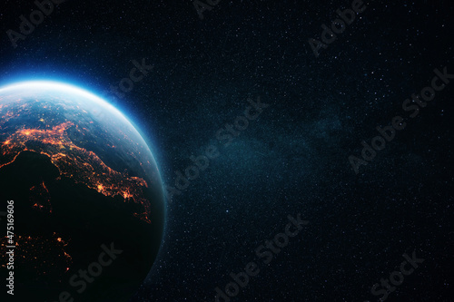 Amazing blue night planet Earth with lights and sunrise in deep starry space. Concept space