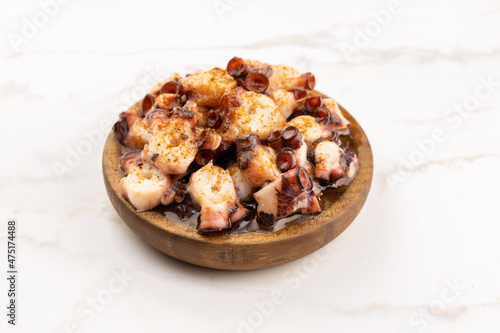 Galician style octopus in wooden plate. Typical appetizer of Galicia  Spain. Pulpo a Feira