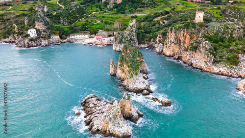Faraglioni of Scopello in Sicily, Italy. Rocks over the sea, aerial view from drone