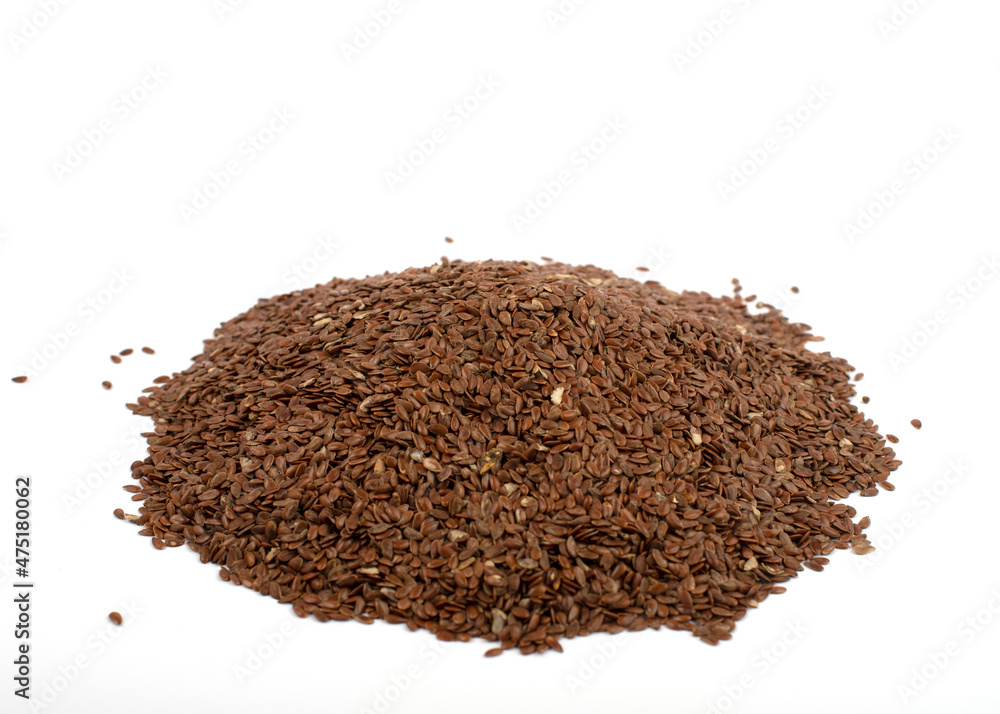 Linseeds heap isolated on white background. Flax seeds pile close up. Linseeds heap isolated on white background. Flax seeds pile close up.