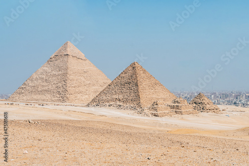 landscape of giza plateau with pyramids at background