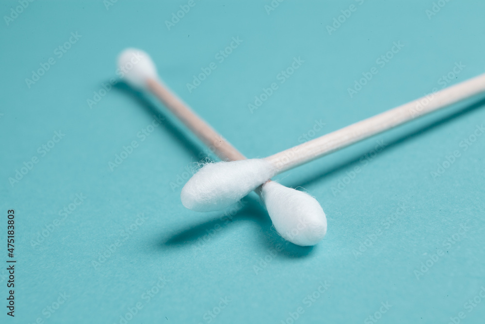cotton swabs on a blue background