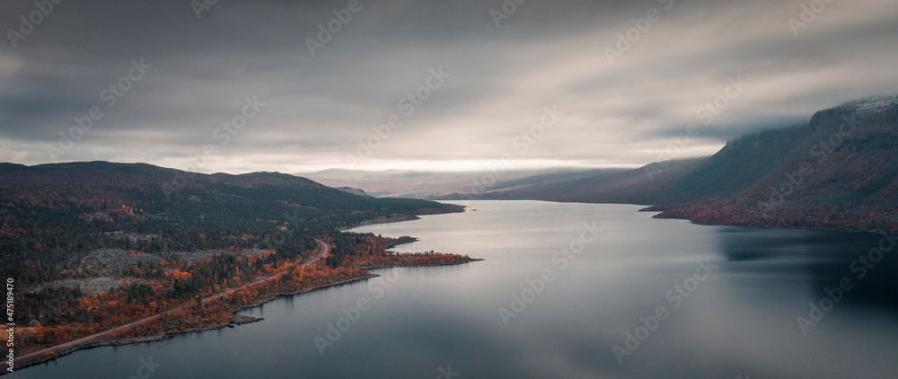 Landscape with lake and mountains in Stora Sjöfallet National Park in autumn in Lapland in Sweden from above. Landscape with lake and mountains in Stora Sjöfallet National Park in autumn in Lapland in Sweden from above.