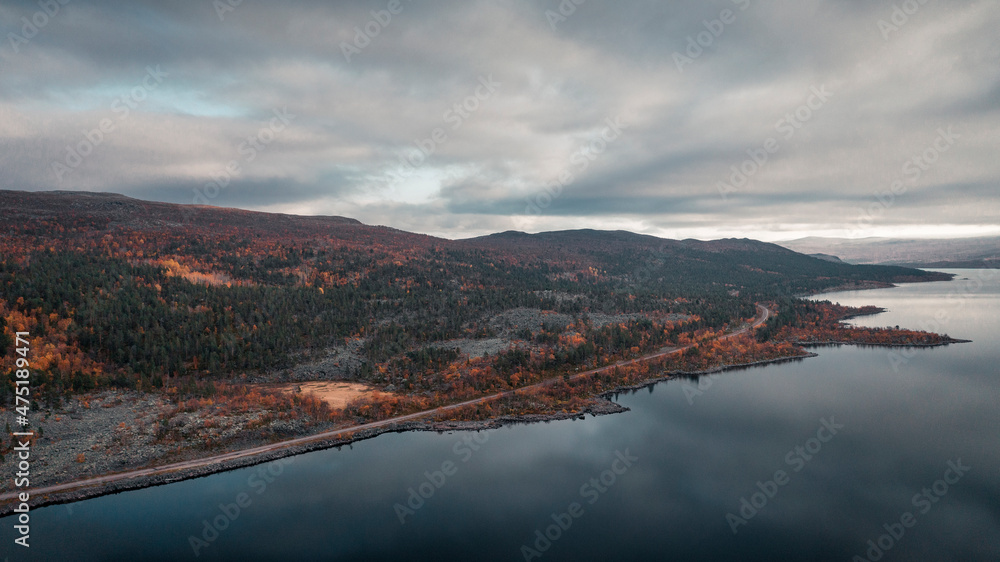 Landscape with lake and mountains in Stora Sjöfallet National Park in autumn in Lapland in Sweden from above. Landscape with lake and mountains in Stora Sjöfallet National Park in autumn in Lapland in Sweden from above.