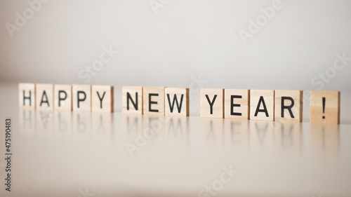 Happy new year - word arranged from wooden letters, new year, celebration 