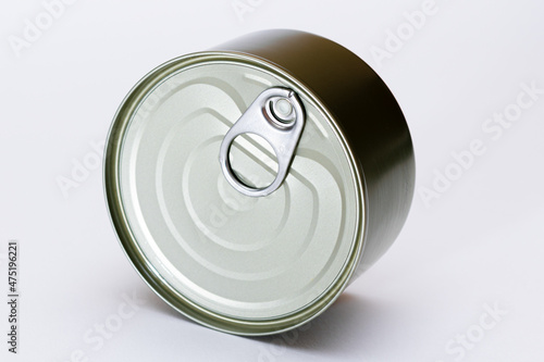 Unopened Tin Can with Blank Edge on White Background. Canned Food. Aluminum Can for Safe and Long Term Storage of Food. Steel Sealed Food Storage Container