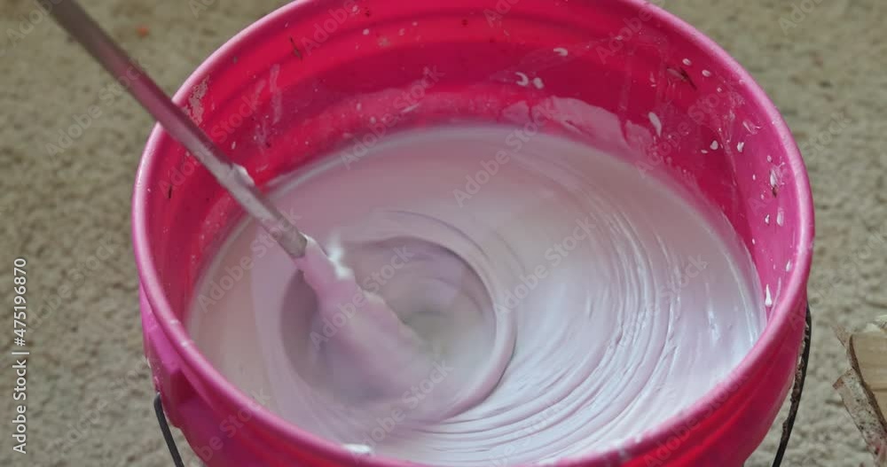 The process of mortar mixing is preparing tile adhesive using mixer tools The process of mortar mixing is preparing tile adhesive using mixer tools