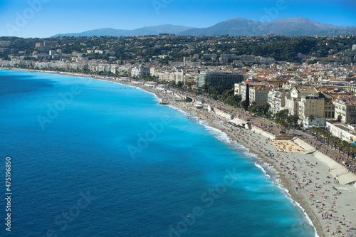 "Promenade des Anglais", beach and turquoise blue mediterranean sea in the city of Nice.