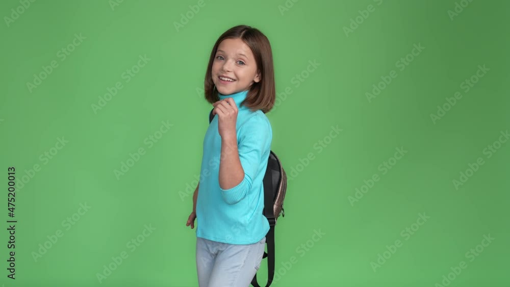 Kid bag suggest okay sign point empty space isolated green color background Kid bag suggest okay sign point empty space isolated green color background