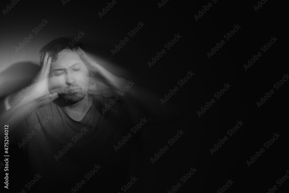 Blurred male portrait in the dark. Male portrait in motion in the dark. Blurred male portrait in the dark. Male portrait in motion in the dark.