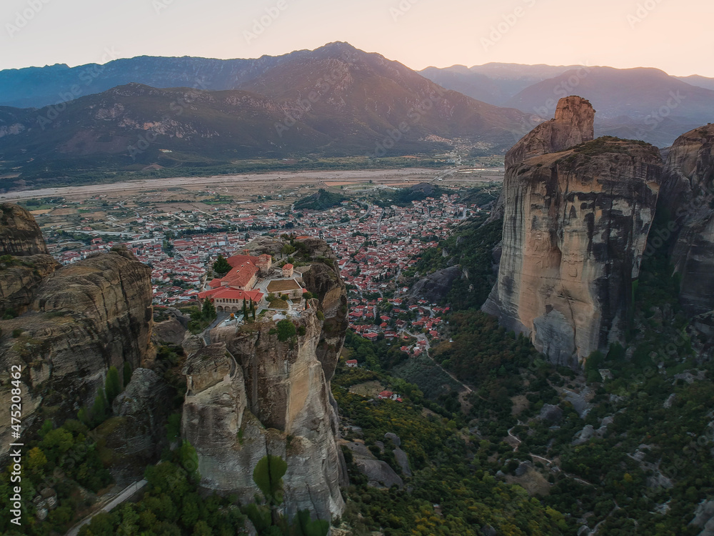 Aerial view over Meteora, a rock formation in central Greece hosting one of the largest most precipitously built complexes of Eastern Orthodox monasteries. Kalampaka, Greece, Europe Aerial view over Meteora, a rock formation in central Greece hosting one of the largest most precipitously built complexes of Eastern Orthodox monasteries. Kalampaka, Greece, Europe