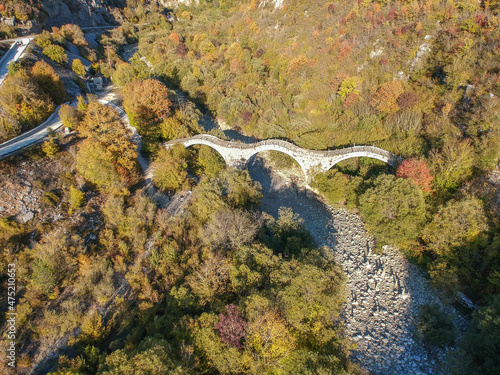Aerial view of old Kalogeriko triple arched stone bridge on Vikos canyon  Zagorohoria  Greece  Europe