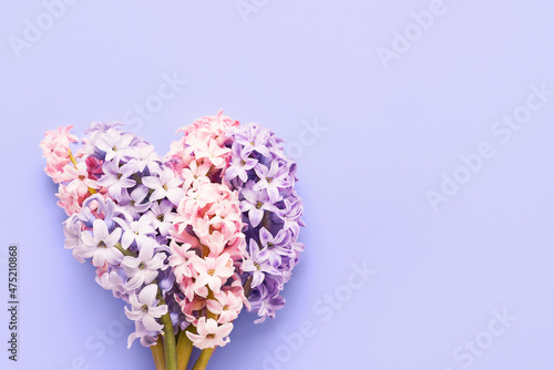 Pink and blue hyacinth flowers bouquet on a lilac very peri background. Greeting card