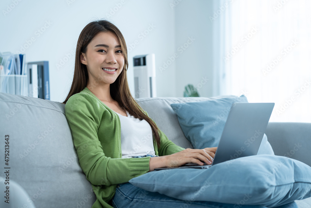 Portrait of Asian beautiful woman sit on sofa in living room at home. Portrait of Asian beautiful woman sit on sofa in living room at home.