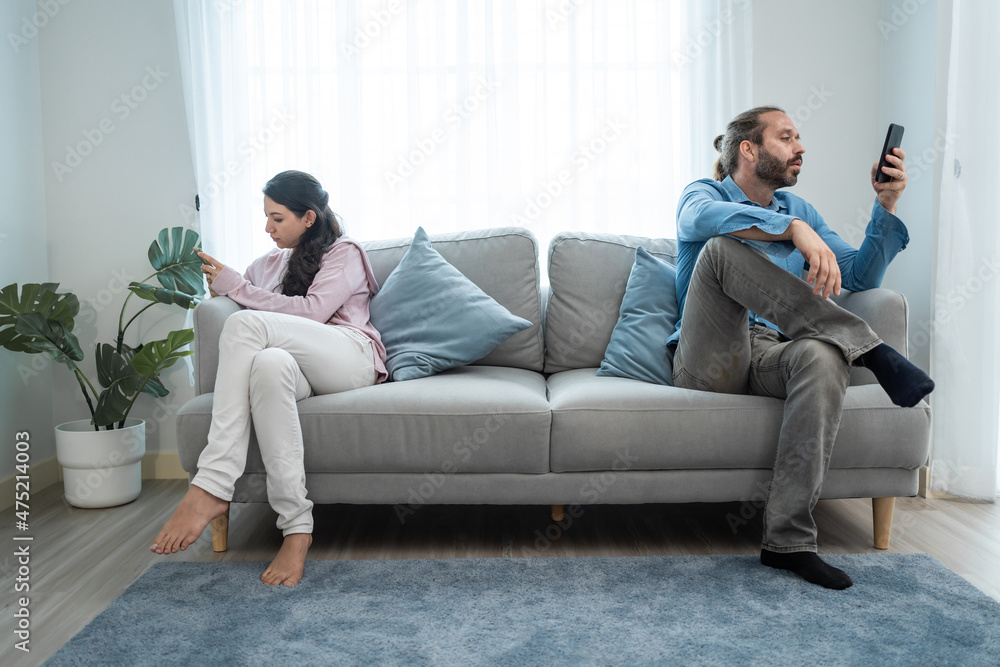 Caucasian phone addict couple don't pay attention with each other. Caucasian phone addict couple don't pay attention with each other.