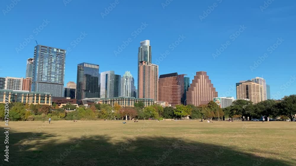 Static shot of Zilker Park, glass buildings and city skyline in Austin, Texas Static shot of Zilker Park, glass buildings and city skyline in Austin, Texas