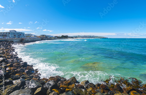 Panoramic View of St Clair Beach Dunedin, South Island New Zealand; Rocky Part of the Beach during High Tide with Rough Seas