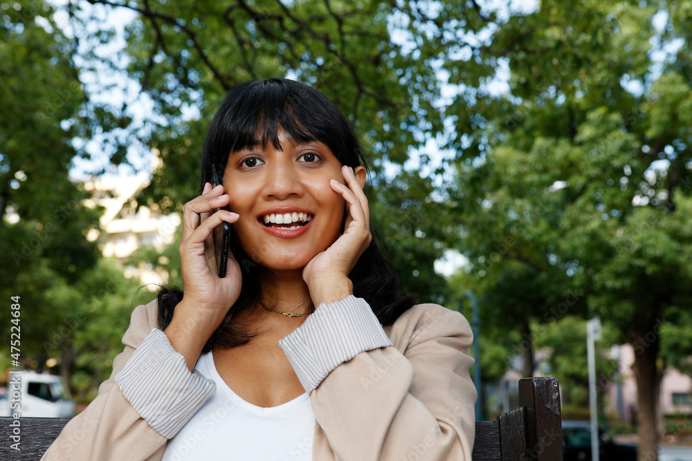 Asian woman using a smart phone Asian woman using a smart phone